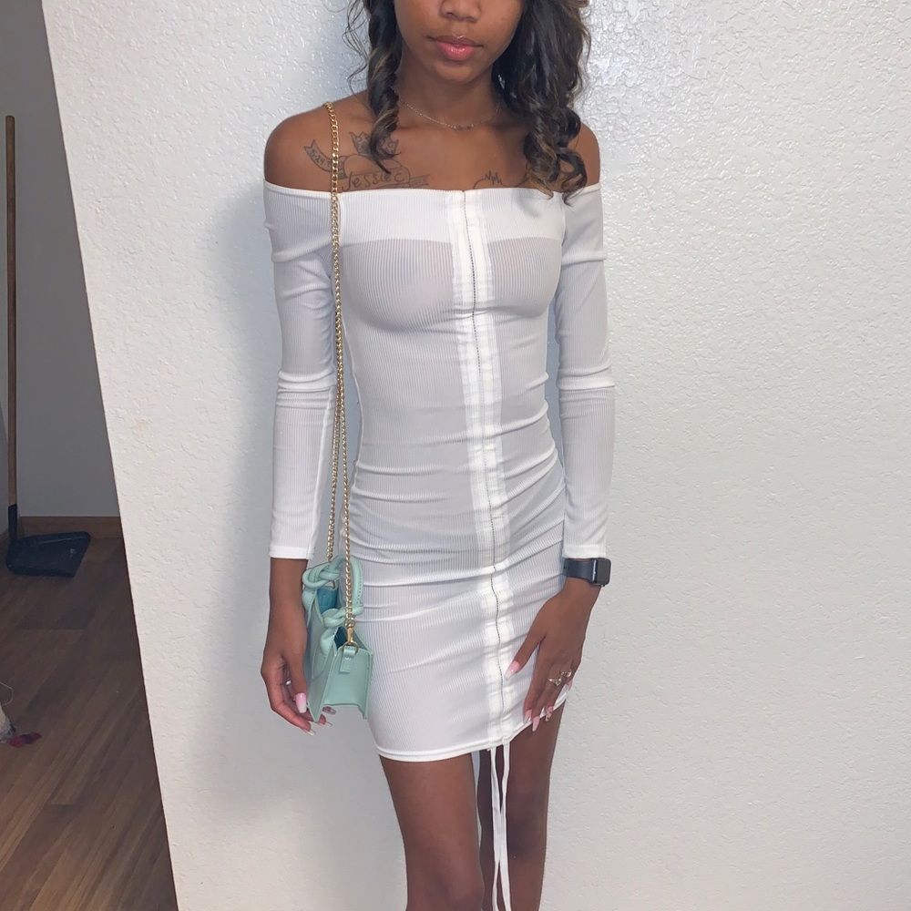 White ribbed long sleeve dress.